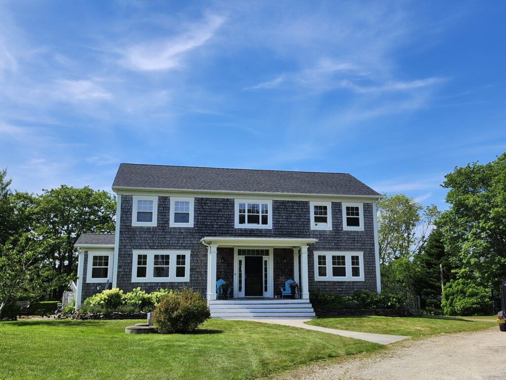 A picture showcasing a roof job done on a house.