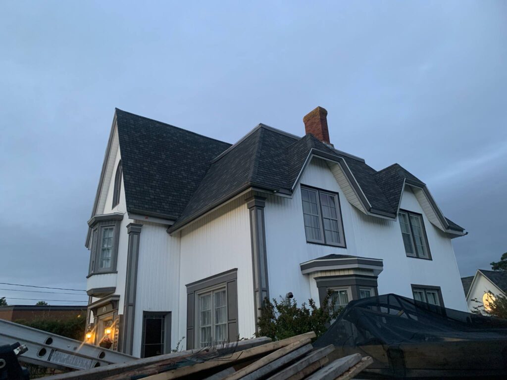 A picture showcasing a roof job done on a house.