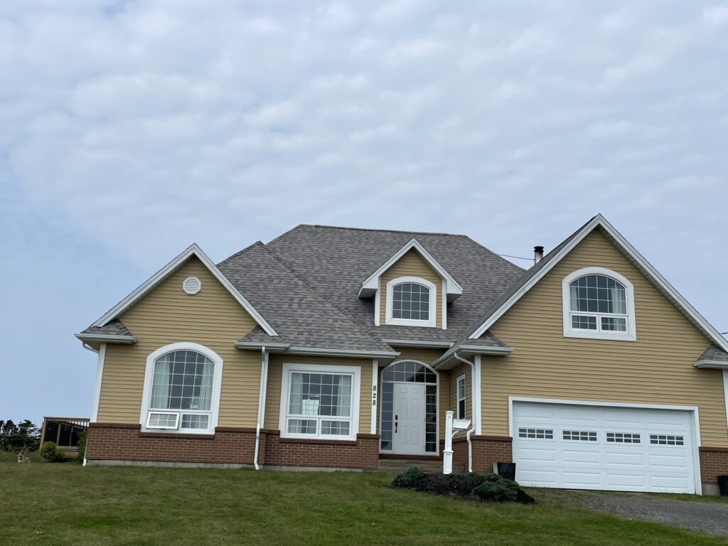 A picture showcasing a roof job done on a house.