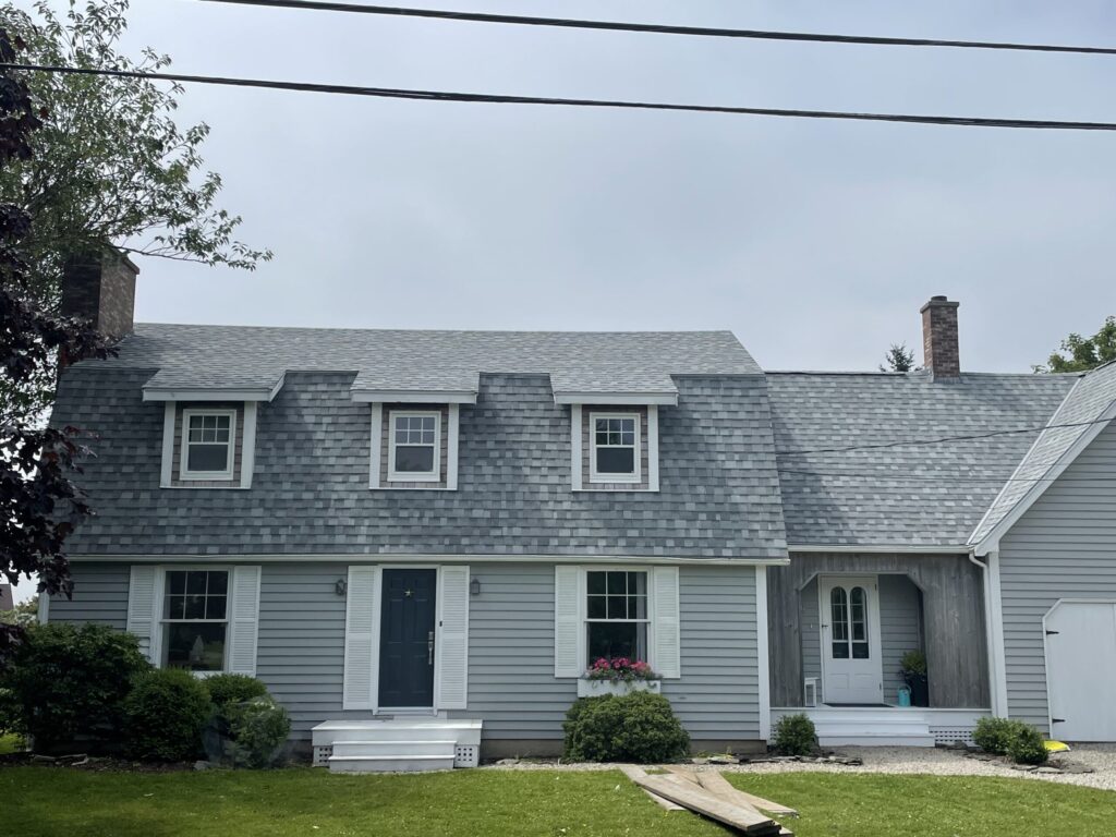 A picture showcasing a roof job done on a house.