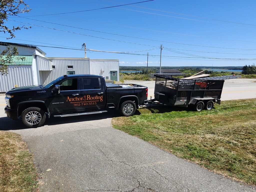 Picture of Ryan's truck towing a trailer with supplies in it.