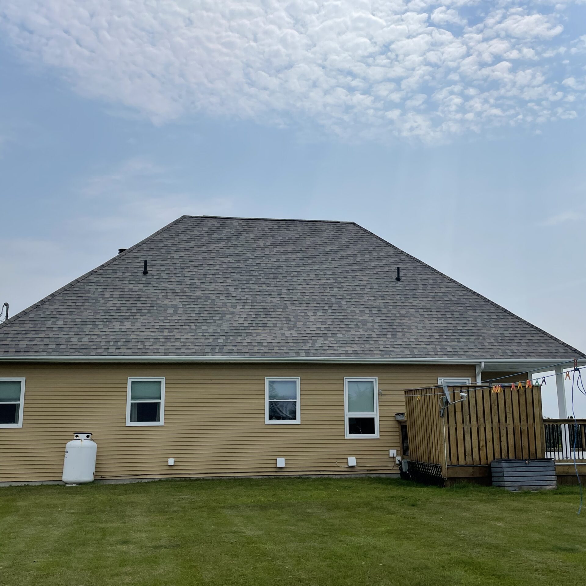 A picture showcasing a roof job done on a house.