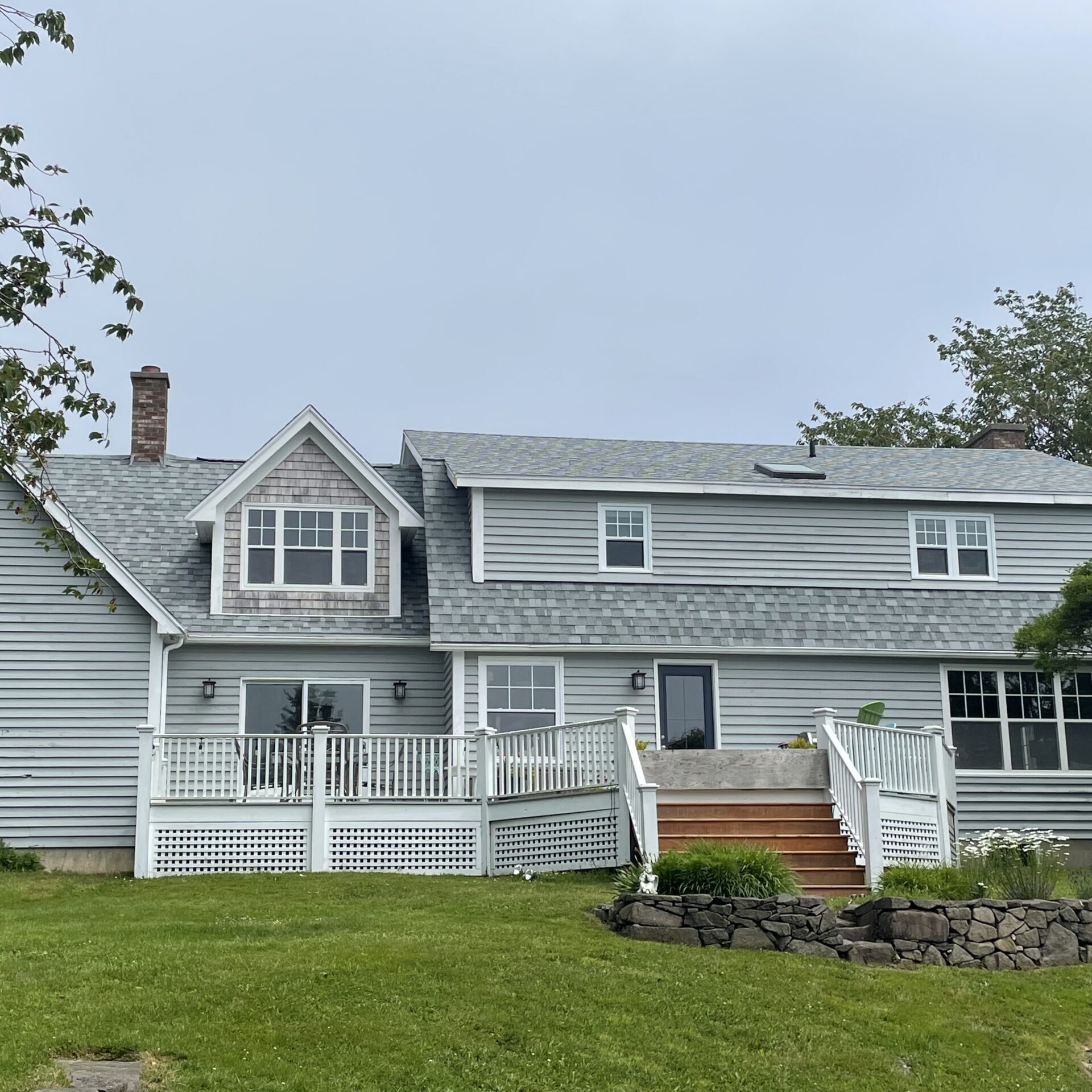 A picture showcasing a roof job done on a house.
